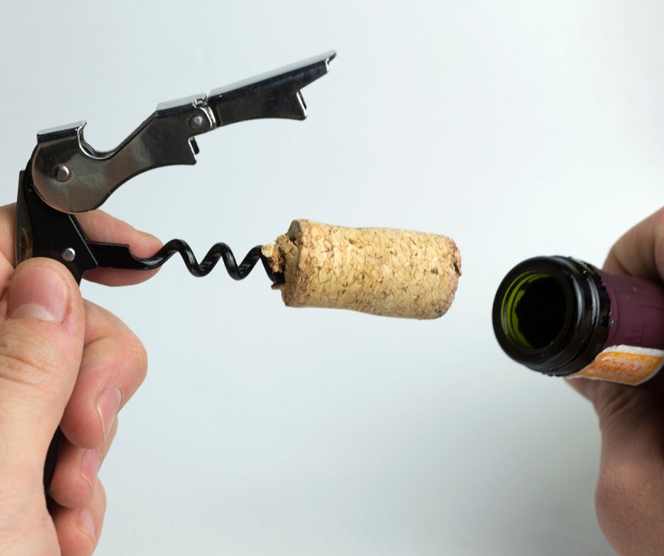 Who should open the bottle of wine?