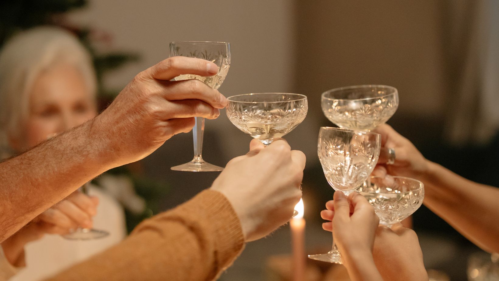 How high should you raise your glass during a toast?