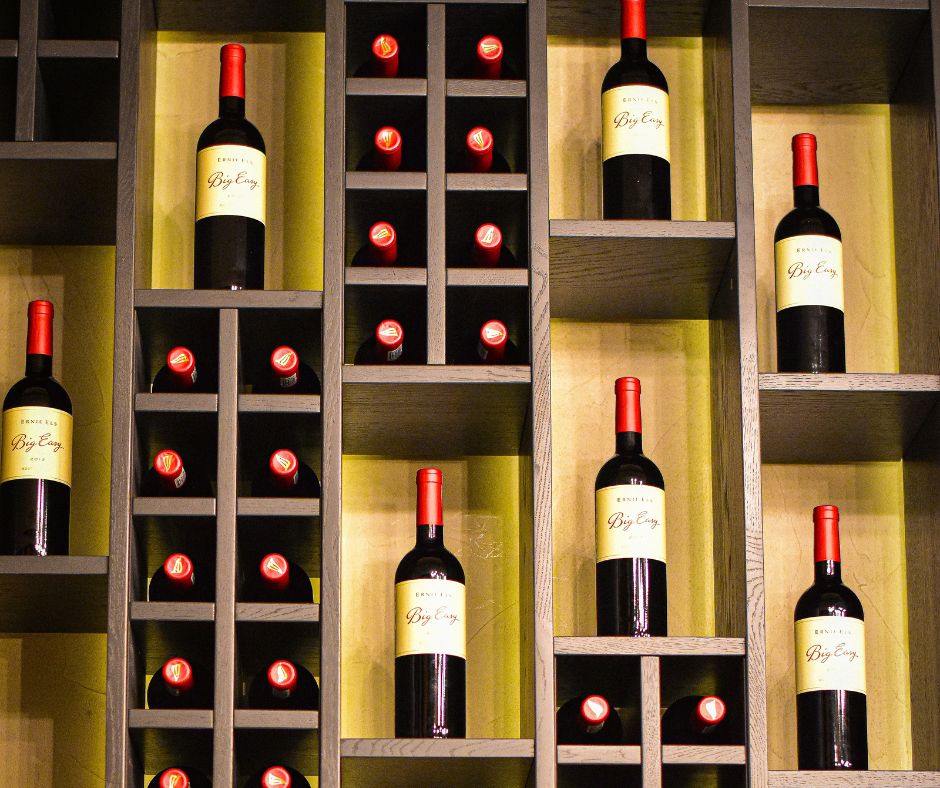 Why do wine bottles have longer necks than other beverages?