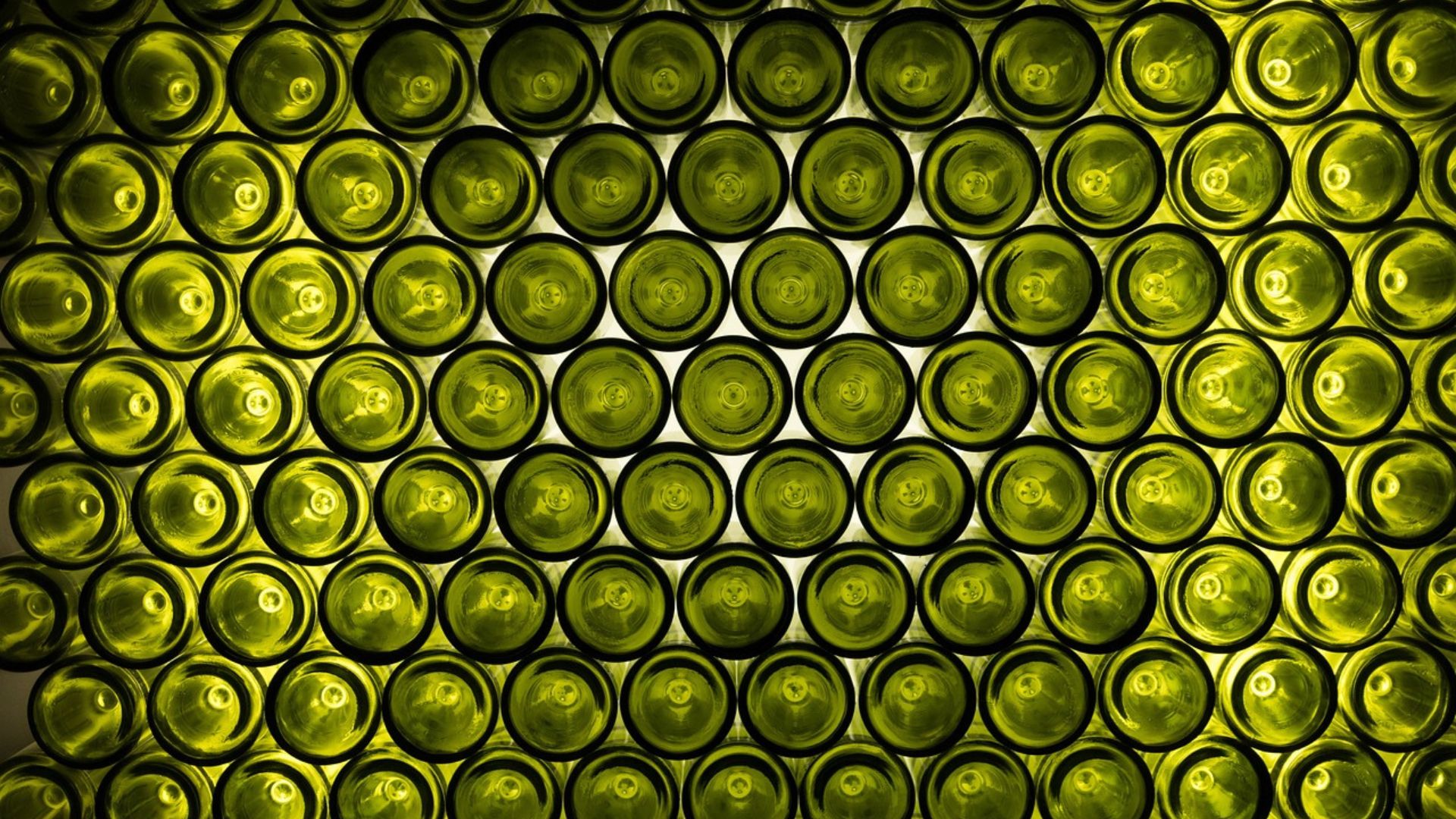 What is the purpose of the concave bottom of wine bottles?