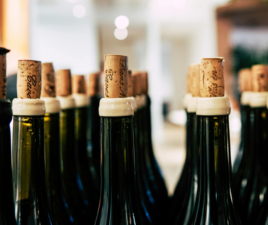 Why do long-aging wine bottles have longer corks?