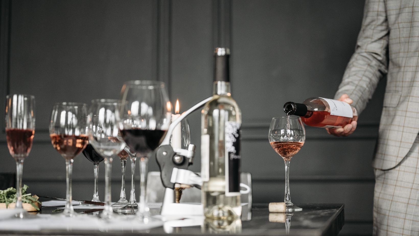 Why do wine bottles have longer necks than other beverages?