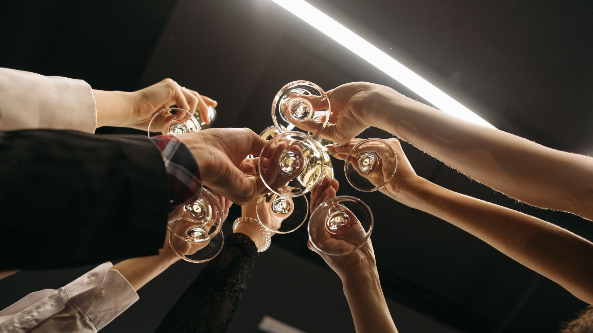 Why do we clink glasses when we toast?