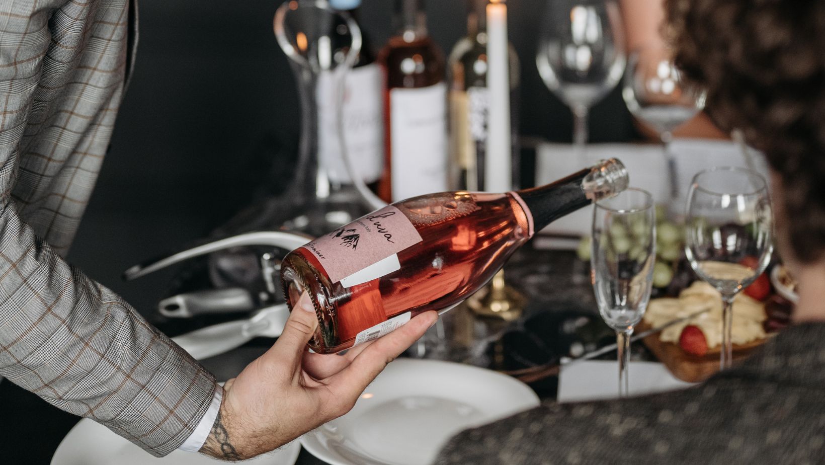 Should the wine be poured first for the person who has already tasted it?